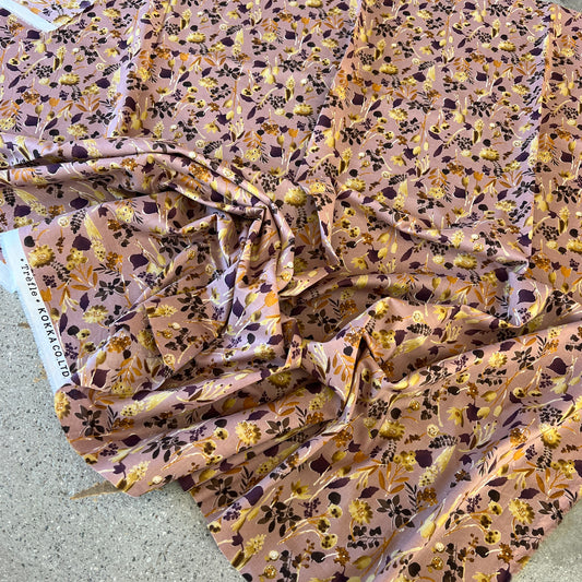 100% cotton fabric made in Japan with a delicate floral design in earthy pink and rust