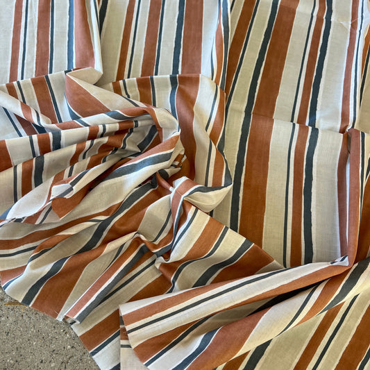 Soft 100% cotton voile stripe in rust  navy and natural